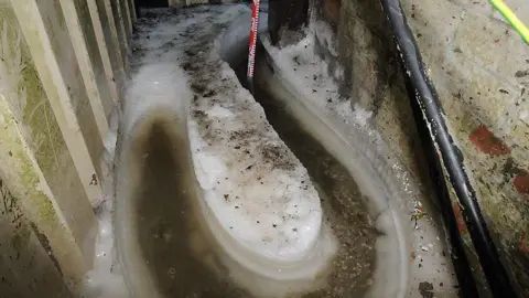 Norfolk Police A passageway in a Banham Poultry chicken factory in Attleborough. A piece of pipe has been removed however where it was can still be seen on the ground after ice formed round it.