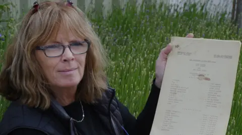 The picture shows Ewbank's consultant specialist Denise Kelly holding the original script from the lost The Morecambe & Wise episode