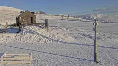 DOI The Mountain Road at the Bungalow covered in a light blanket of snow.