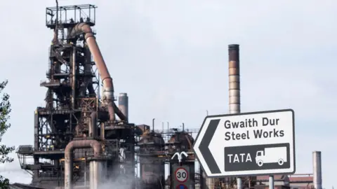 Reuters A view of the Port Talbot steelworks, with a road sign in view