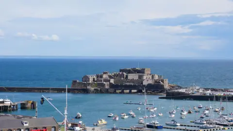 A shot of Guernsey's Castle Cornet on a sunny day with the marina in view