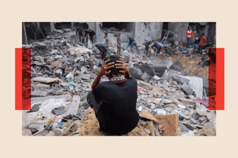 Getty Images A child reacts as people salvage belongings amid the rubble of a damaged building following strikes on Rafah