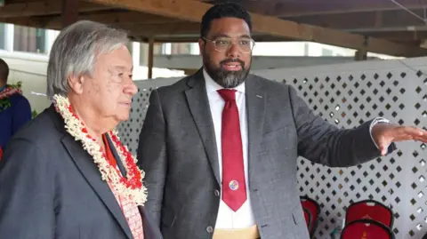 Getty Images Lord Fatafehi Fakafanua (R), speaker of Tonga's parliament, briefs UN Secretary General Antonio Guterres during in Nuku'alofa on August 26, 2024