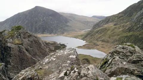 BBC/Gwyndaf Hughes Mountains and a lake