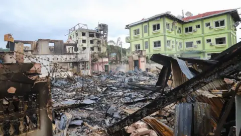 Getty Images This photo taken on July 1, 2024 shows a destroyed house following fighting between Myanmar's military and the Ta'ang National Liberation Army (TNLA) ethnic armed group in Kyaukme