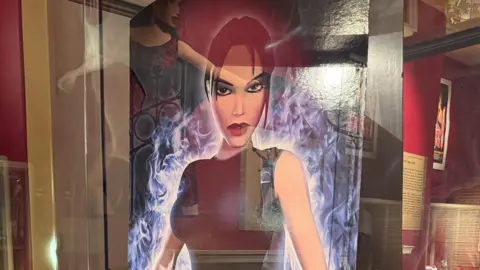 A cardboard cutout of a less polygonal version of the character