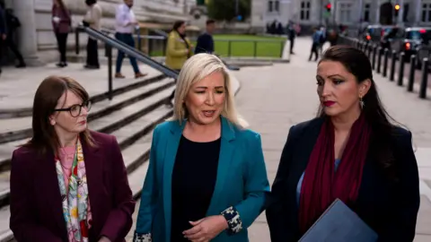 Caoimhe Archibald, Michelle O'Neill and Emma Little-Pengelly outside the treasury 