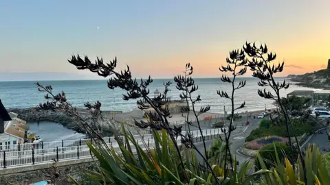 BBC Weather Watcher, EmmaH Ventnor, Isle of Wight - beach and seafront on a calm evening as the sun sets.