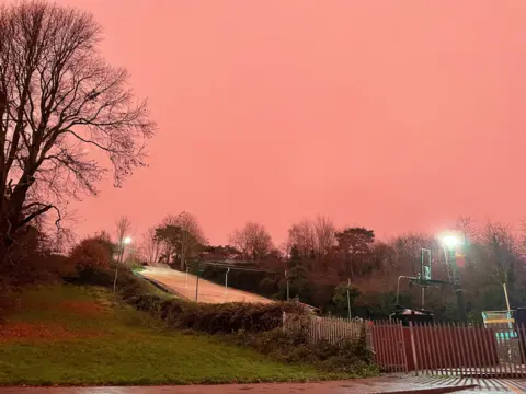 Sky turns pink following storm