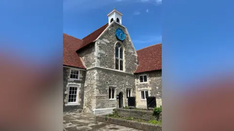 An external image of the Poor Priests' Hospital in Canterbury