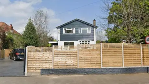 Google A house in Chepstow surrounded by a wooden fence