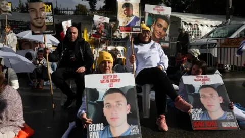 The families of the hostages and supporters in Reuters participate in a demonstration calling for an immediate return of the hostages held in Gaza, near the Prime Minister's residence in Jerusalem (February 12, 2025)