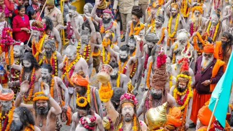 Ankit Srinivas Sadhus participate in a procession at the Mahakumbh