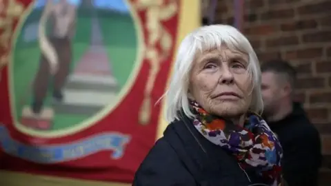 Getty Images Anne Scargill, the former wife of NUM leader Arthur Scargill, joins miners, union members and local people in a protest march from Knottingley Town Hall to the Miners Welfare Centre marking the end of deep coal mining in Britain on December 19, 2015 in Knottingley, England.