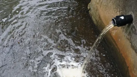 Getty Images An image of a Combined Sewer Overflow discharging into a waterway