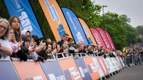 ABP Southampton Marathon Crowds at the marathon festival stood behind crash barriers.