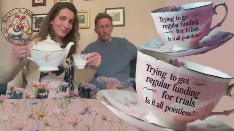 Andrew Davies Mr and Mrs Davies sitting at a table. she is holding a teapot and cup and he is sitting next to her. Two large tea cups are superimposed to the right of the picture.