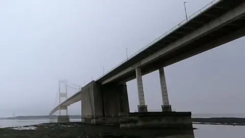 The Severn Bridge pictured from below on a misty day. 