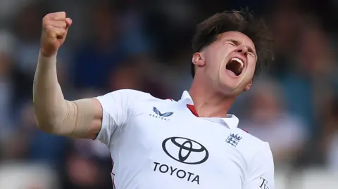 England fast bowler Sonny Baker celebrates taking a wicket