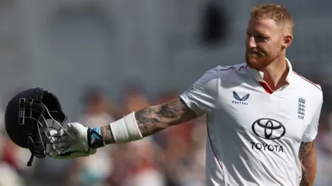 England captain Ben Stokes holds his helmet out behind him as he walks off after being dismissed in his final Test innings