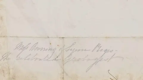19th Century handwriting which reads: "Miss Anning of Lyme Regis/The Celebrated Geologist" in pencil.