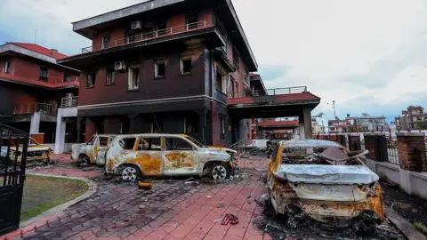 Getty Images Ministerial quarters in Bhaisipati, Lalitpur, on September 17, 2025, a week after protesters set them ablaze and vandalized them