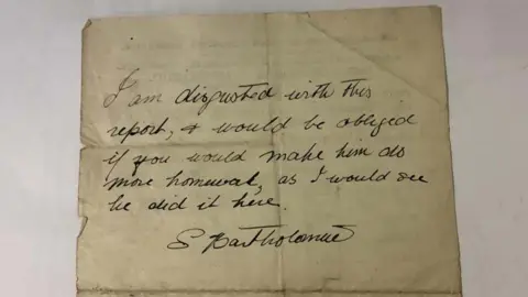 Hansons The back of the report with the handwritten note from Eric Morecambe's mother that reads "I am disgusted with this report and would be obliged if you would make him do more homework as I would see he did it here, S. Bartholomew."