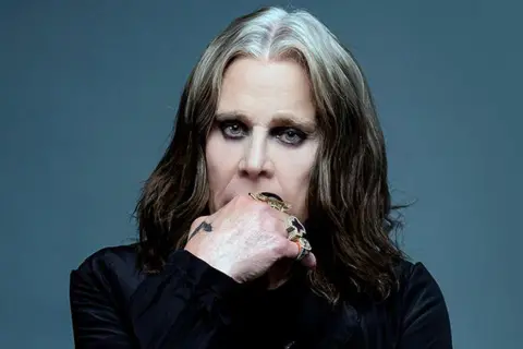 Ross Halpin A long-haired Ozzy Osbourne wearing eye liner and gold rings on his fingers