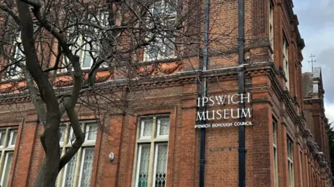 Ipswich Museum Ipswich Borough Council in white lettering sign on red brickwork on a Victorian building 