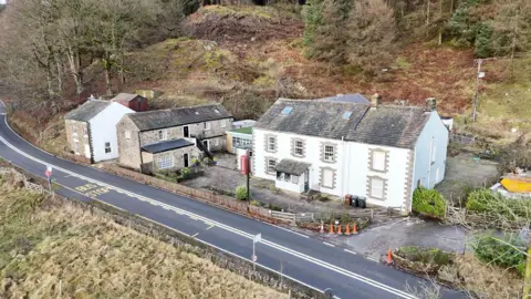 An aerial view of the Snake Pass Inn, situated along Snake Pass