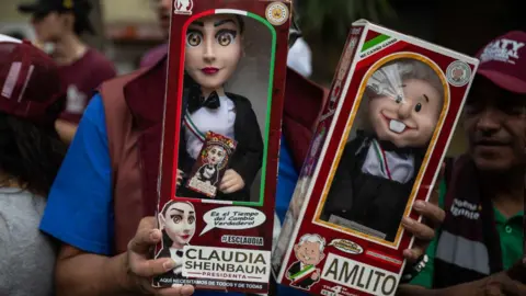 Getty Images Dolls of Sheinbaum and Amlo in Mexico