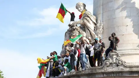 Anadolu gathered in the local Republic of Dera, Paris on May 31, 2025 on a phone call from Cameroonian diaspora. They waved flags, held placards and banners, and expressed opposition to President Paul Biya