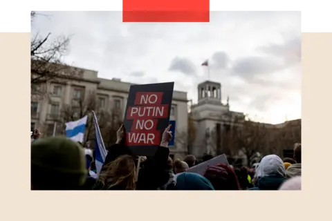 Getty Images Protesters demonstrate against Putin and Russia's war on Ukraine in front of the Russian embassy in Berlin, Germany