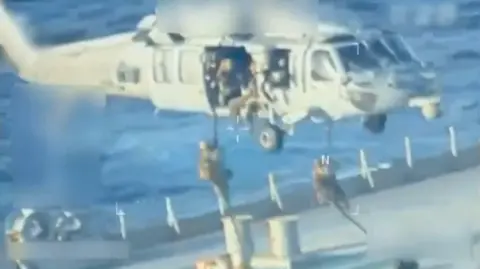 US forces abseil on to an oil tanker in a video released on 10 December 2025