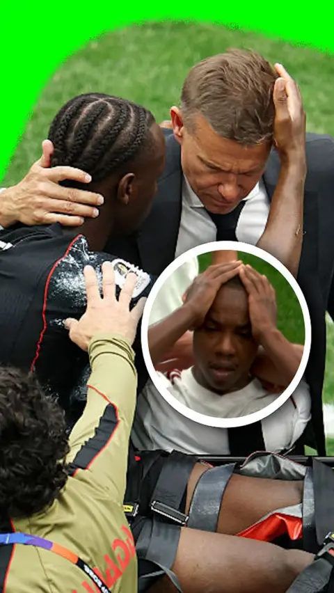 Canada's Jesse Marsch hugs Ismael Kone as he's taken off the pitch in a strecher in the 2026 World Cup.