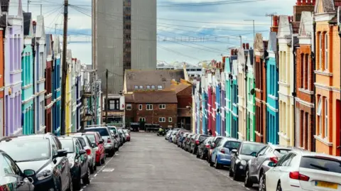 Getty Images Cars parked on a side street in Brighton.