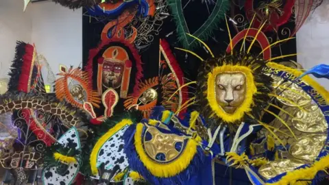Lily May-Symonds/BBC Costumes and masks made for Luton carnival