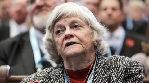 A head and shoulders crop of Widdecombe shows her looking to the left of frame while sitting in an audience at a Brexit Party rally at the Emmanuel Centre in London in 2019.