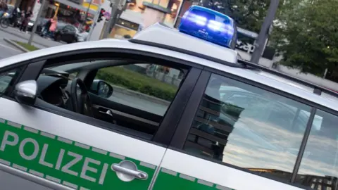 Getty Images Police car with blue light seen in Munich