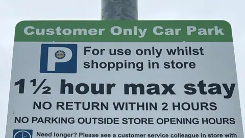 Jonathan Woodhead A parking sign which says in large text "Customer only car park"