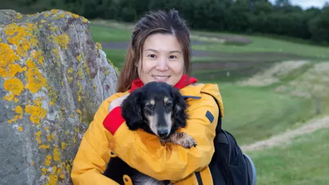 Mike Bolam Sue Siu and her dog at the Crawick Multiverse