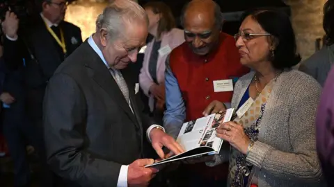 PA Media King Charles III meets with Trustees and volunteers in the Great Hall during his visit to the 700-year-old medieval manor, Samlesbury Hall, near Preston in Lancashire