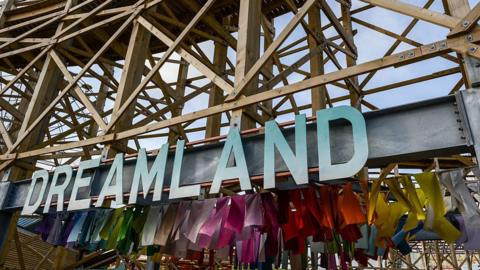 The Dreamland sign below a wooden rollercoaster