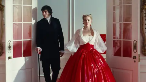 Warner Bros Jacob Elordi and Margot Robbie from a scene in the film