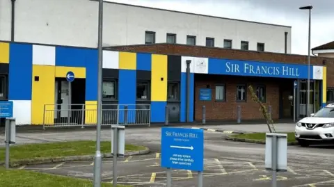 LDRS The front of Sir Francis Hill Community Primary School with a car park