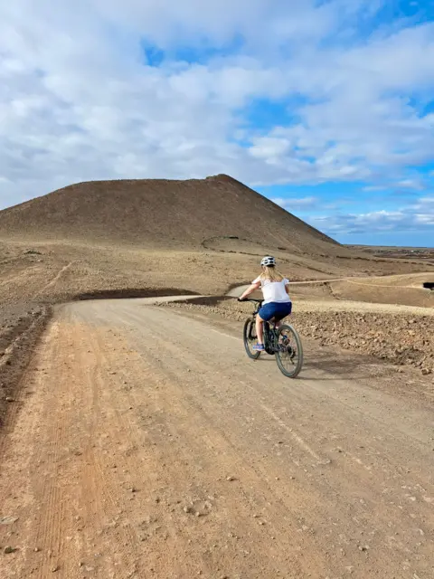 Carolyn Montgomery A woman on a bicycle in Fuerteventura 