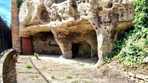 Janine Tanner View of the newly cleared cave entrance, with a fence running to the left of the picture