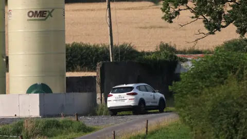 PA Media Garda Car near a farm