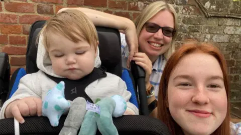 HANDOUT Kit with his family