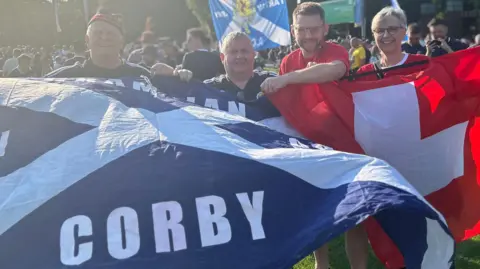 Paul McKenna Two Scotland fans and two Swiss fans with flags